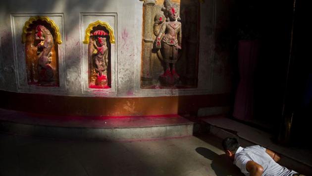 A devotee offers prayers during Ambubachi festival at the Kamakhya temple in Guwahati, Assam. The four-day Ambubachi festival is a celebration of Kamakhya’s yearly menstrual cycle, and it brings hundreds of thousands of devotees to the temple. (Anupam Nath / AP) A devotee offers prayers during Ambubachi festival at the Kamakhya temple in Guwahati, Assam. The four-day Ambubachi festival is a celebration of Kamakhya’s yearly menstrual cycle, and it brings hundreds of thousands of devotees to the temple. (Anupam Nath / AP)