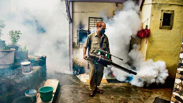 An employee of Brihanmumbai Municipal Corporation (BMC) fumigates during an anti-malaria drive inside a slum in Mumbai. Municipal authorities have identified specific areas of the city with mills, railway yards and construction sites where accumulated water offers a breeding ground for mosquitoes leading to a wider spread of malaria. (Indranil Mukherjee / AFP) An employee of Brihanmumbai Municipal Corporation (BMC) fumigates during an anti-malaria drive inside a slum in Mumbai. Municipal authorities have identified specific areas of the city with mills, railway yards and construction sites where accumulated water offers a breeding ground for mosquitoes leading to a wider spread of malaria. (Indranil Mukherjee / AFP)