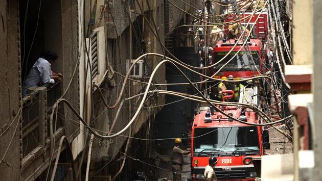 Fire fighters and tenders carry out rescue operations at a rubber factory at Jhilmil industrial area, in New Delhi. (Vipin Kumar / HT Photo) Fire fighters and tenders carry out rescue operations at a rubber factory at Jhilmil industrial area, in New Delhi. (Vipin Kumar / HT Photo)