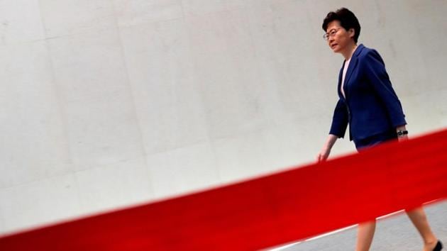 Hong Kong Chief Executive Carrie Lam walks to speak to the media over an extradition bill in Hong Kong, China. (Tyrone Siu / REUTERS)
