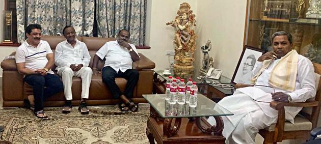 Karnataka chief minister HD Kumaraswamy with rebel Congress MLA MTB Nagaraj at the residence of Congress Legislature Party (CLP) leader Siddaramaiah in Bengaluru on Saturday.(ANI PHOTO.) Karnataka chief minister HD Kumaraswamy with rebel Congress MLA MTB Nagaraj at the residence of Congress Legislature Party (CLP) leader Siddaramaiah in Bengaluru on Saturday.(ANI PHOTO.)