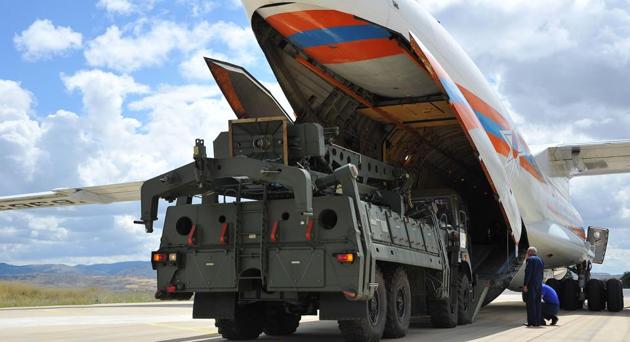 A handout photograph taken and released on July 12, 2019, by the Turkish Defence Ministry shows a Russian military cargo plane carrying S-400 missile defence system from Russia to the Murted military airbase (also known as Akincilar millitary airbase), in Ankara.(AFP)