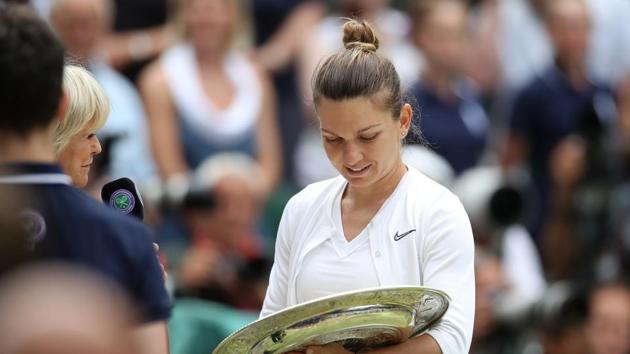 Romania's Simona Halep reacts after lifting the title. (REUTERS) Romania's Simona Halep reacts after lifting the title. (REUTERS)