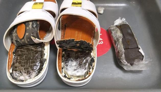 Central Industrial Security Force personnel on Friday apprehended from the Kannur International airport here a Doha-bound passenger who was allegedly carrying hashish estimated to be worth Rs seven lakh.(ANI/Twitter) Central Industrial Security Force personnel on Friday apprehended from the Kannur International airport here a Doha-bound passenger who was allegedly carrying hashish estimated to be worth Rs seven lakh.(ANI/Twitter)