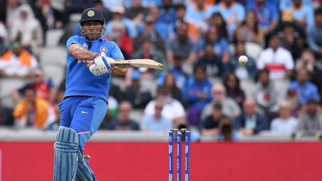 India's Mahendra Singh Dhoni plays a shot during the 2019 Cricket World Cup first semi-final.(AFP)