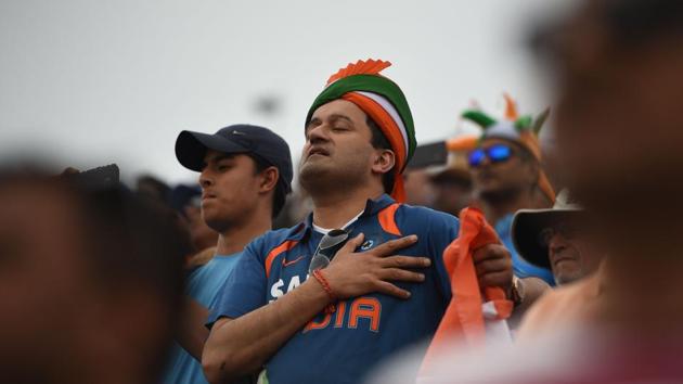 Indian supporters stand during the national anthem ahead of the start of the 2019 Cricket World Cup semi-final between India and New Zealand at Old Trafford in Manchester, England. (Oli Scarff / AFP) Indian supporters stand during the national anthem ahead of the start of the 2019 Cricket World Cup semi-final between India and New Zealand at Old Trafford in Manchester, England. (Oli Scarff / AFP)