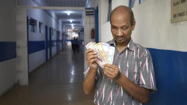 Amarnath De, who is blind and works as a Braille proofreader at JPM Senior Secondary School, said the difference in the size of notes is always more important than tactile marks. (Burhaan Kinu/HT PHOTO) Amarnath De, who is blind and works as a Braille proofreader at JPM Senior Secondary School, said the difference in the size of notes is always more important than tactile marks. (Burhaan Kinu/HT PHOTO)