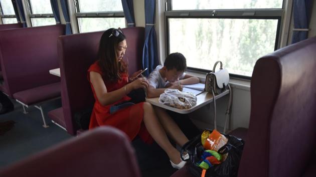 A woman and child on a train between Hotan and Kashgar. Over the past few years, cultural leaders in the Uighur community have disappeared, raising fears they have been detained. (Greg Baker / AFP) A woman and child on a train between Hotan and Kashgar. Over the past few years, cultural leaders in the Uighur community have disappeared, raising fears they have been detained. (Greg Baker / AFP)