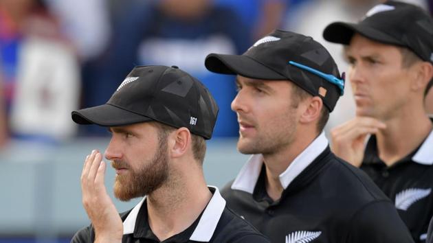 New Zealand's captain Kane Williamson (L) looks on at the trophy presentation after defeat.(AFP)