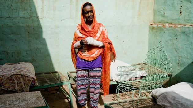 Amel Tajeldin, a 41-year-old mother of four, said she and her husband took turns watching their children. “While it was his turn to look after the children, I took part in the demonstrations,” she said. She had been teaching songs to street children in a makeshift tent at the sit-in. During the June 3 raid, they were beaten by members of Rapid Support Forces (RSF) and police, owing to which her arms are broken. (Umit Bektas / REUTERS) Amel Tajeldin, a 41-year-old mother of four, said she and her husband took turns watching their children. “While it was his turn to look after the children, I took part in the demonstrations,” she said. She had been teaching songs to street children in a makeshift tent at the sit-in. During the June 3 raid, they were beaten by members of Rapid Support Forces (RSF) and police, owing to which her arms are broken. (Umit Bektas / REUTERS)