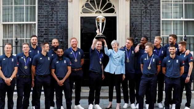 England's Eoin Morgan and Britain's Prime Minister Theresa May lift the trophy as they pose with the team. (REUTERS) England's Eoin Morgan and Britain's Prime Minister Theresa May lift the trophy as they pose with the team. (REUTERS)