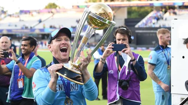 England's captain Eoin Morgan celebrates with the World Cup trophy.(AFP)