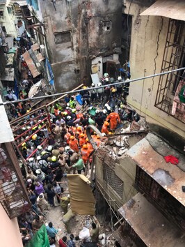 Rescue personnel were seen clearing rubble and cutting through iron girders by hand, and taking the help of local residents, who had formed a human chain, to pass the debris.(Photo: Kunal Patil/ Hindustan Times)