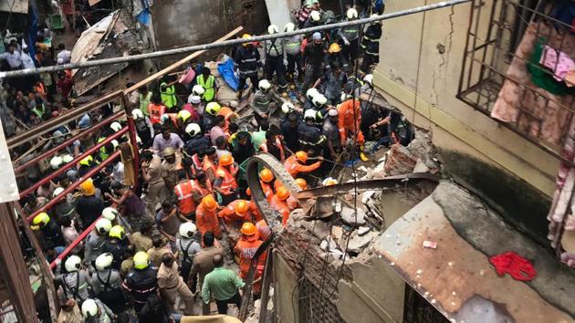 A century-old building collapsed in south Mumbai’s congested Dongri, killing at least three people as rescuers struggled to reach the 40 others who are trapped under the debris, officials said. A toddler was among the seven people to be pulled alive from the Kesarbai building in Tandel Street in Abdul Hamid Durga, an area with narrow bylanes, and rushed to a hospital. Doctors said the condition of the child was stable. (Bhushan Koyande / HT Photo) A century-old building collapsed in south Mumbai’s congested Dongri, killing at least three people as rescuers struggled to reach the 40 others who are trapped under the debris, officials said. A toddler was among the seven people to be pulled alive from the Kesarbai building in Tandel Street in Abdul Hamid Durga, an area with narrow bylanes, and rushed to a hospital. Doctors said the condition of the child was stable. (Bhushan Koyande / HT Photo)