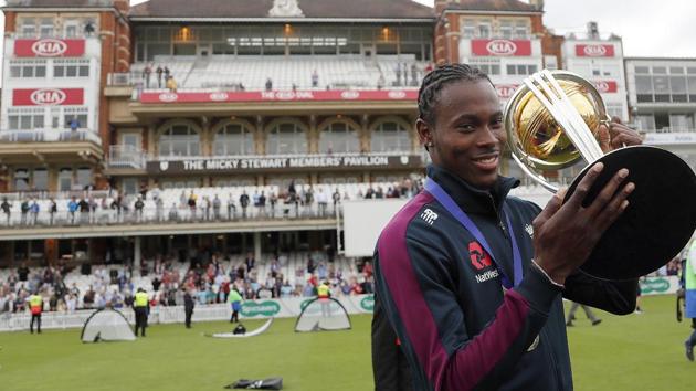 England's Jofra Archer celebrates with the trophy at the Oval in London.(AP)