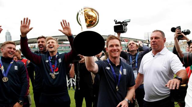 England's Eoin Morgan with team mates and the trophy during the celebrations.(REUTERS)