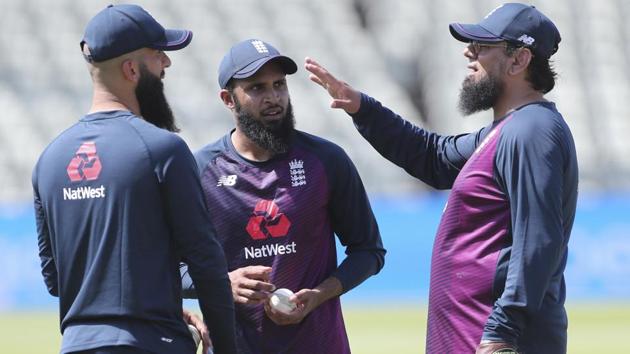 England's Moeen Ali, left, and Adil Rashid, center, listen to spin bowling consultant Saqlain Mushtaq. (AP) England's Moeen Ali, left, and Adil Rashid, center, listen to spin bowling consultant Saqlain Mushtaq. (AP)