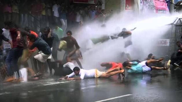 Police use water cannon on the members of ABVP and BJYM during their protest against the attack on SFI activist Akhil Chandran at Thiruvananthapuram’s University College on Monday. (ANI) Police use water cannon on the members of ABVP and BJYM during their protest against the attack on SFI activist Akhil Chandran at Thiruvananthapuram’s University College on Monday. (ANI)