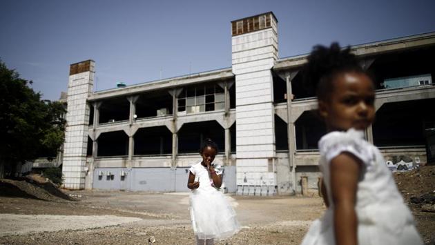 Girls from Eritrea play in an open area opposite to the Central Bus Station. Opened in 1993 with hopes of rejuvenating one of its poorest neighbourhoods, the station is now commonly referred to as “the Monstrosity”. An urban development dream gone bad, the seven-storey jumble of grungy corridors was once envisaged as a slick shopping centre serving streams of commuters. (Corinna Kern / REUTERS) Girls from Eritrea play in an open area opposite to the Central Bus Station. Opened in 1993 with hopes of rejuvenating one of its poorest neighbourhoods, the station is now commonly referred to as “the Monstrosity”. An urban development dream gone bad, the seven-storey jumble of grungy corridors was once envisaged as a slick shopping centre serving streams of commuters. (Corinna Kern / REUTERS)