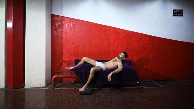 A man poses for an artist as a model at the bus station. The station’s diversity reflects the neighbourhood, where a large foreign migrant population lives in mostly run-down apartment blocks. (Corinna Kern / REUTERS) A man poses for an artist as a model at the bus station. The station’s diversity reflects the neighbourhood, where a large foreign migrant population lives in mostly run-down apartment blocks. (Corinna Kern / REUTERS)