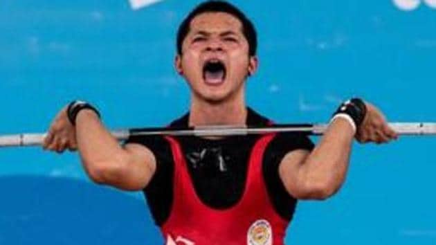 Lalrinnunga Jeremy in action during the Weightlifting Mens 62kg Group A competition.(REUTERS)
