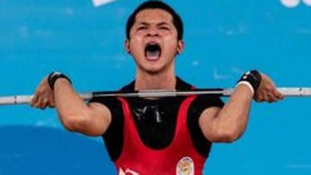 Lalrinnunga Jeremy in action during the Weightlifting Mens 62kg Group A competition.(REUTERS)