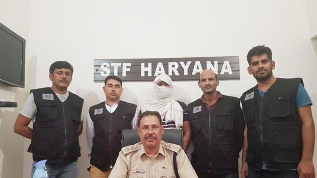 Dr. Ambuj Jain (face covered) was arrested from Nahan, Himachal Pradesh on Monday night.(Sourced) Dr. Ambuj Jain (face covered) was arrested from Nahan, Himachal Pradesh on Monday night.(Sourced)