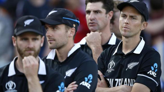 New Zealand's Trent Boult, right, crosses his arms as he waits for the trophy presentation after losing the Cricket World Cup final match between England and New Zealand at Lord's cricket ground in London, Sunday, July 14, 2019. England won after a super over after the scores ended tied after 50 overs each. (AP Photo/Matt Dunham) (AP) New Zealand's Trent Boult, right, crosses his arms as he waits for the trophy presentation after losing the Cricket World Cup final match between England and New Zealand at Lord's cricket ground in London, Sunday, July 14, 2019. England won after a super over after the scores ended tied after 50 overs each. (AP Photo/Matt Dunham) (AP)