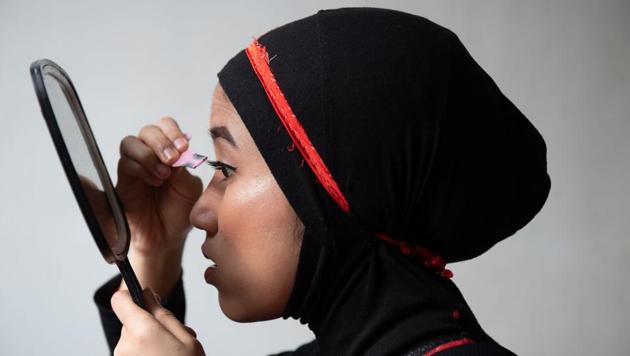 Diana applies makeup backstage before a match organised by Malaysia Pro Wrestling. “As Phoenix, I’m a totally different person. She may be small, but she can do things that people can’t imagine. When she’s in the ring, she’s fast and always wants to win,” said Diana. (Mohd Rasfan / AFP) Diana applies makeup backstage before a match organised by Malaysia Pro Wrestling. “As Phoenix, I’m a totally different person. She may be small, but she can do things that people can’t imagine. When she’s in the ring, she’s fast and always wants to win,” said Diana. (Mohd Rasfan / AFP)