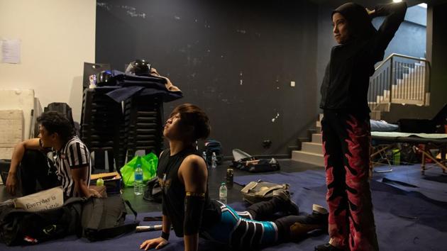 Diana warms up backstage before a match organised by Malaysia Pro Wrestling. “Even though I am Muslim, and I wear the hijab, nothing can stop me from doing what I love,” she said in the ring after winning a recent fight. She takes part in local outfit Malaysia Pro Wrestling (MyPW), which has similarities with hugely popular World Wrestling Entertainment from the United States. (Mohd Rasfan / AFP) Diana warms up backstage before a match organised by Malaysia Pro Wrestling. “Even though I am Muslim, and I wear the hijab, nothing can stop me from doing what I love,” she said in the ring after winning a recent fight. She takes part in local outfit Malaysia Pro Wrestling (MyPW), which has similarities with hugely popular World Wrestling Entertainment from the United States. (Mohd Rasfan / AFP)