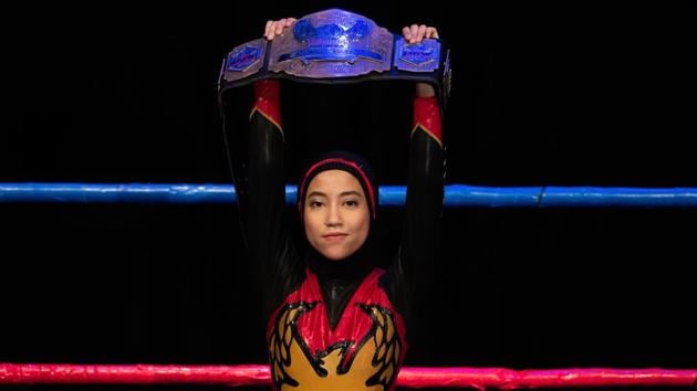 The hijab-wearing Malaysian wrestler known as Nor "Phoenix" Diana holds the Wrestlecon championship belt after winning a match against male opponents organised by Malaysia Pro Wrestling in Kuala Lumpur, Malaysia. A hijab-wearing, diminutive Malaysian wrestler known as "Phoenix" cuts an unusual figure in the ring, a female Muslim fighter taking on hulking opponents in a male-dominated world. (Mohd Rasfan / AFP) The hijab-wearing Malaysian wrestler known as Nor "Phoenix" Diana holds the Wrestlecon championship belt after winning a match against male opponents organised by Malaysia Pro Wrestling in Kuala Lumpur, Malaysia. A hijab-wearing, diminutive Malaysian wrestler known as "Phoenix" cuts an unusual figure in the ring, a female Muslim fighter taking on hulking opponents in a male-dominated world. (Mohd Rasfan / AFP)