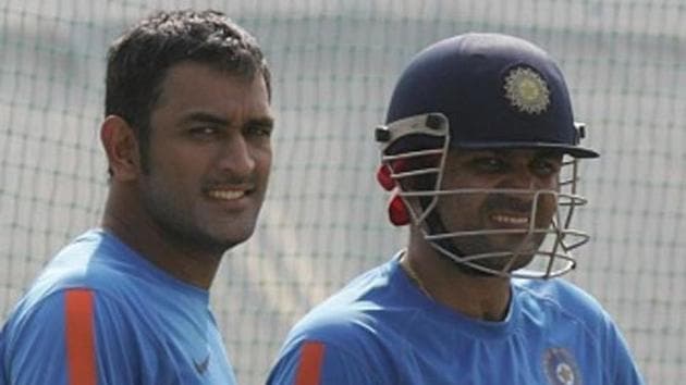 A file photo of MS Dhoni (L) and Virender Sehwag.(Hindustan Times via Getty Images)