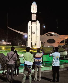 People standing next to models of Indian Space Research Organization (ISRO)'s Geosynchronous Satellite launch Vehicle (GSLV) MkII at Satish Dhawan Space Center after the Chandrayaan-2 mission was aborted from Sriharikota on Sunday.(Photo: ANI)