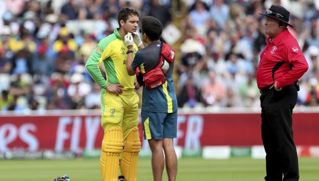 Australia's Alex Carey is attended by a medic after he was hit off the bowling of England's Jofra Archer during the Cricket World Cup. (AP)