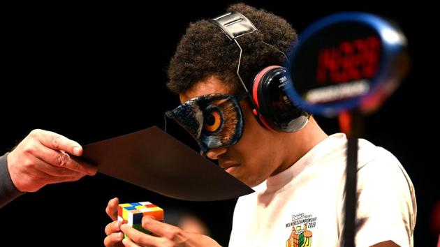 A competitor races against the clock in the 3x3x3 Blindfolded event at the World Cube Association (WCA) World Championships held in Melbourne, Australia. The World Championships are held every two years and have attracted 905 competitors from around the world competing in 18 different events. The most famous twisty puzzle is the 3x3x3 Rubik's Cube. (William West / AFP) A competitor races against the clock in the 3x3x3 Blindfolded event at the World Cube Association (WCA) World Championships held in Melbourne, Australia. The World Championships are held every two years and have attracted 905 competitors from around the world competing in 18 different events. The most famous twisty puzzle is the 3x3x3 Rubik's Cube. (William West / AFP)