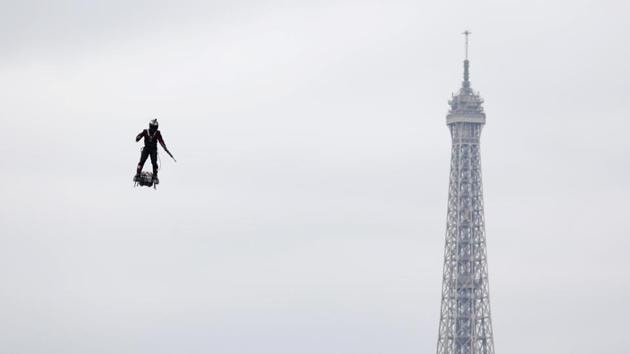 Franky Zapata flies on a Flyboard during the traditional Bastille Day military parade on the Champs-Elysees Avenue with the Eiffel Tower in the background in Paris, France. (Charles Platiau / REUTERS) Franky Zapata flies on a Flyboard during the traditional Bastille Day military parade on the Champs-Elysees Avenue with the Eiffel Tower in the background in Paris, France. (Charles Platiau / REUTERS)