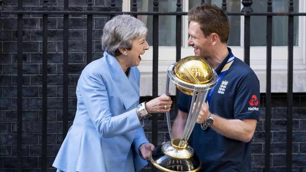 Britain's Prime Minister Theresa May (L) shares a joke with England's captain Eoin Morgan.(AFP)