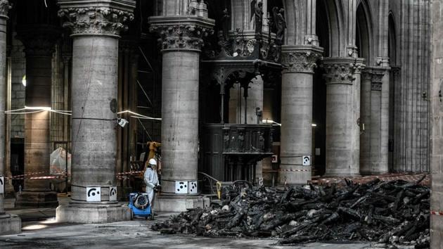 Riester said the workers were wearing special masks because of the presence of lead which seeped into some of the stone during the fire. “We need to take all the necessary measures,” the minister said. He said the five-year deadline set by Macron was “not the question for today. The question is securing Notre-Dame”. (Stephane de Sakutin / Pool / AFP) Riester said the workers were wearing special masks because of the presence of lead which seeped into some of the stone during the fire. “We need to take all the necessary measures,” the minister said. He said the five-year deadline set by Macron was “not the question for today. The question is securing Notre-Dame”. (Stephane de Sakutin / Pool / AFP)
