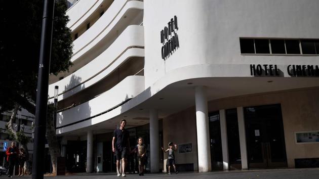 The Hotel Cinema on Dizengoff Square, a building built in 1936 by architect Yehuda Magidovitch. The square is a city landmark dominated by prominent Bauhaus buildings. The Bauhaus design school was founded in Weimar, Germany, by Walter Gropius in April 1919, exactly a decade after Tel Aviv was born as a small seaside village on sand dunes near the ancient Mediterranean port of Jaffa.  (Thomas Coex / AFP) 