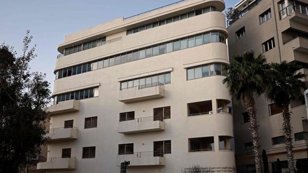 The Montefiore House, a building built in 1920’s by architect Isaac Schwarz. Unlike their predecessors who built for the German climate, the architects who settled in Tel Aviv had to adapt their work to the local climate. They used less glass to minimise heat and incorporated balconies to catch the sea breezes. (Thomas Coex / AFP) 