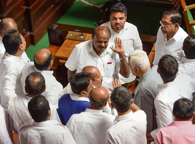 Governor Vajubhai Vala on Friday set a new deadline for Karnataka Chief Minister Kumaraswamy to prove majority in the assembly. This followed a day of fast–paced developments where the Assembly missed the 1.30 deadline set by the governor, who shot off a report on political developments to the Centre soon after. (Shailendra Bhojak / PTI) Governor Vajubhai Vala on Friday set a new deadline for Karnataka Chief Minister Kumaraswamy to prove majority in the assembly. This followed a day of fast–paced developments where the Assembly missed the 1.30 deadline set by the governor, who shot off a report on political developments to the Centre soon after. (Shailendra Bhojak / PTI)