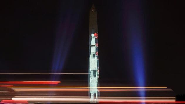 Traffic passes by an image of the Saturn V rocket, which launched the Apollo 11 astronauts into space, as it is projected onto the side of the Washington Monument to mark the 50th anniversary of the first lunar mission in Washington, USA. (Joshua Roberts / REUTERS) Traffic passes by an image of the Saturn V rocket, which launched the Apollo 11 astronauts into space, as it is projected onto the side of the Washington Monument to mark the 50th anniversary of the first lunar mission in Washington, USA. (Joshua Roberts / REUTERS)