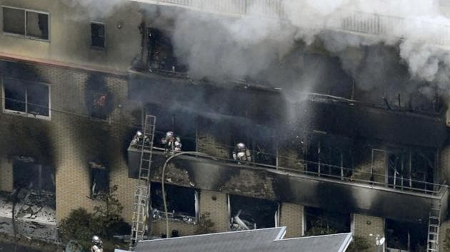 An aerial view shows firefighters battling the fires at the site where a man started a fire after spraying a liquid, at a three-story studio of Kyoto Animation Co. in Kyoto, western Japan, in this photo taken by Kyodo July 18, 2019. Mandatory credit Kyodo/via REUTERS(REUTERS)