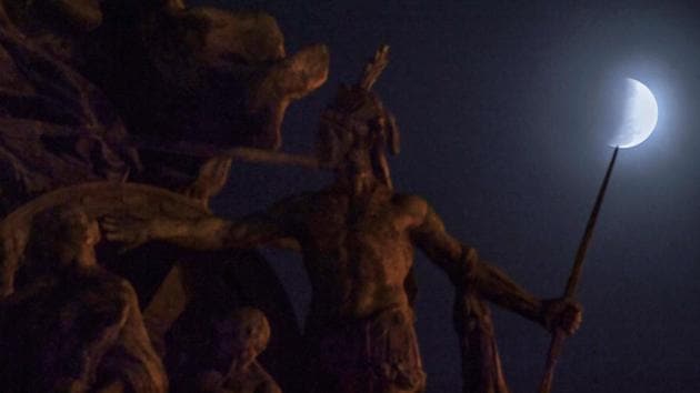 The moon is seen behind the Independence Monument during a partial lunar eclipse in Sao Paulo, Brazil. (Nelson Almeida / AFP) The moon is seen behind the Independence Monument during a partial lunar eclipse in Sao Paulo, Brazil. (Nelson Almeida / AFP)