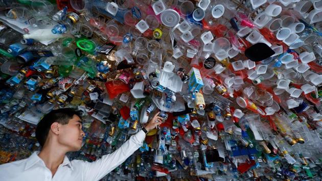 A visitor looks at a hanging art installation by a group of artists made from scraps of plastics, cans and containers at an exhibition “Reduce the Litter” at the French Cultural Centre in Hanoi, Vietnam. The exhibition takes on the perspective on production and consumption, portraying pollution from domestic waste causing harmful impact on the environment and people's health. (Nhac Nguyen / AFP) A visitor looks at a hanging art installation by a group of artists made from scraps of plastics, cans and containers at an exhibition “Reduce the Litter” at the French Cultural Centre in Hanoi, Vietnam. The exhibition takes on the perspective on production and consumption, portraying pollution from domestic waste causing harmful impact on the environment and people's health. (Nhac Nguyen / AFP)