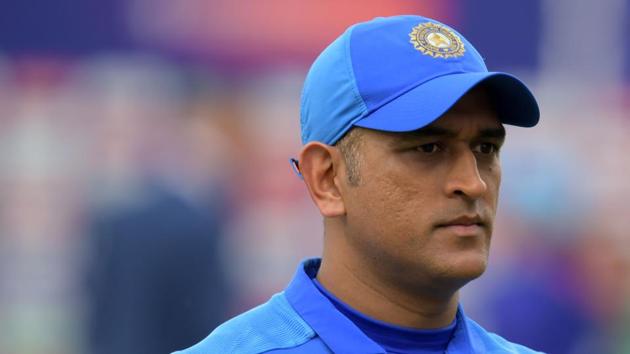 India's Mahendra Singh Dhoni reacts at the end of play during the 2019 Cricket World Cup first semi-final between New Zealand and India at Old Trafford in Manchester, northwest England, on July 10, 2019. - New Zealand beat India by 18 runs. (Photo by Dibyangshu Sarkar / AFP) / RESTRICTED TO EDITORIAL USE(AFP)