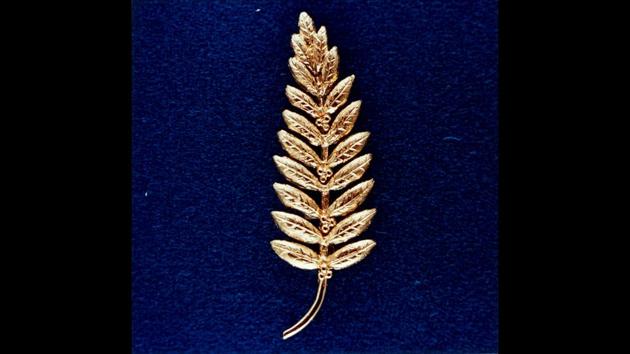 This is the gold replica of an olive branch, a traditional symbol of peace, left on the Moon's surface by Apollo 11 crewmembers. Astronaut Neil A. Armstrong, commander, placed the small replica (less than half a foot in length) on the Moon. The gesture represented a wish for peace for all mankind. (NASA) This is the gold replica of an olive branch, a traditional symbol of peace, left on the Moon's surface by Apollo 11 crewmembers. Astronaut Neil A. Armstrong, commander, placed the small replica (less than half a foot in length) on the Moon. The gesture represented a wish for peace for all mankind. (NASA)