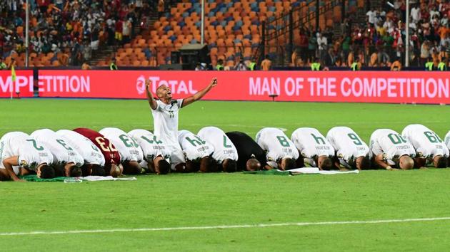 Algerian players pray as they celebrate after winning the 2019 Africa Cup of Nations (CAN) Final football match between Senegal and Algeria at the Cairo International Stadium in Cairo, Egypt. (Guiseppe Cacace / AFP) Algerian players pray as they celebrate after winning the 2019 Africa Cup of Nations (CAN) Final football match between Senegal and Algeria at the Cairo International Stadium in Cairo, Egypt. (Guiseppe Cacace / AFP)