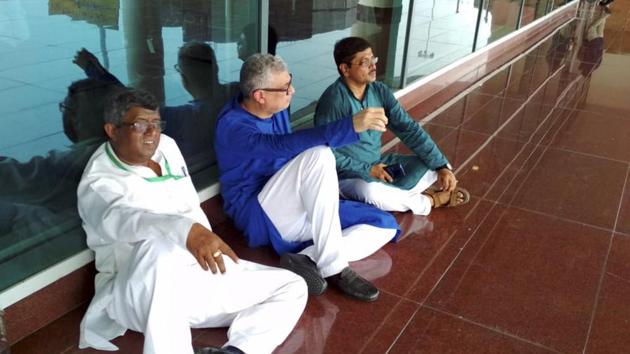 Varanasi: Derek O'Brien led TMC delegation sit on a dharna, after they were stopped by police at the airport, while on their way to meet family members of victims killed in clashes over a land dispute in Sonbhadra on July 17, at Varanasi airport, Saturday, July 20, 2019.(PTI)