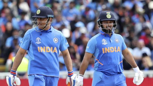 India's Mahendra Singh Dhoni, left, and Rishabh Pant stand in the field between batting during the Cricket World Cup match between India and Bangladesh at Edgbaston in Birmingham, England, Tuesday, July 2, 2019. (AP Photo/Rui Vieira) (AP) India's Mahendra Singh Dhoni, left, and Rishabh Pant stand in the field between batting during the Cricket World Cup match between India and Bangladesh at Edgbaston in Birmingham, England, Tuesday, July 2, 2019. (AP Photo/Rui Vieira) (AP)